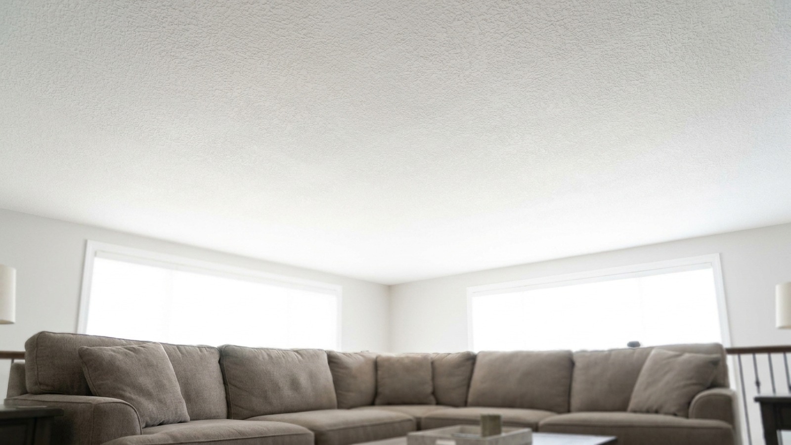 Drywall ceiling water-stain repair complete — invisible patch + matched paint