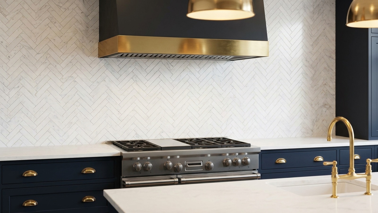 Herringbone marble backsplash behind a Wolf range — Carmel custom home