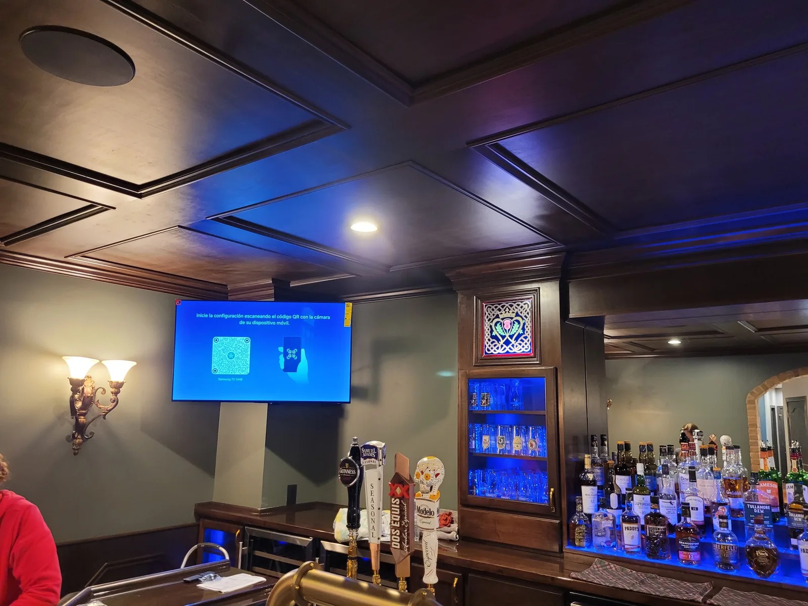 Custom TV mount over a private home bar — Indianapolis luxury install